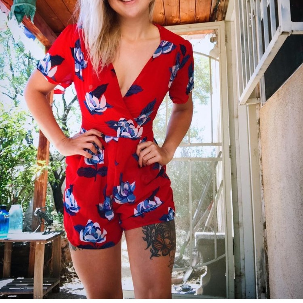 Darling red romper with blue flowers